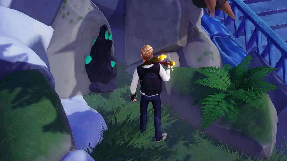 Disney Dreamlight Valley player using a pickaxe near Emeralds