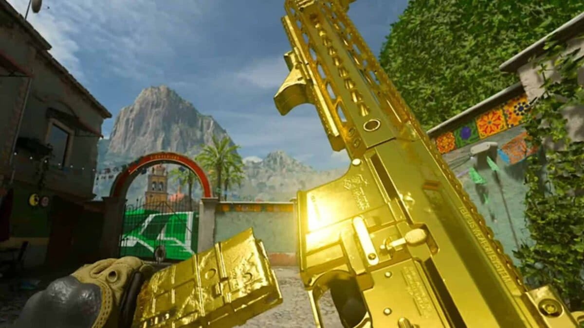 modern warfare 2 player holding up golden gun camo