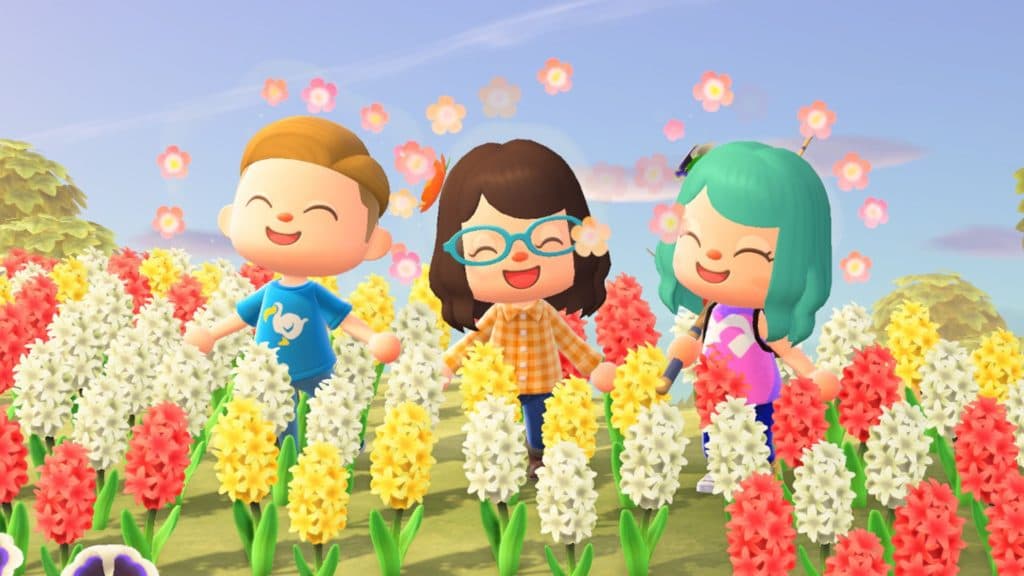 Three Animal Crossing New Horizons avatars among flowers