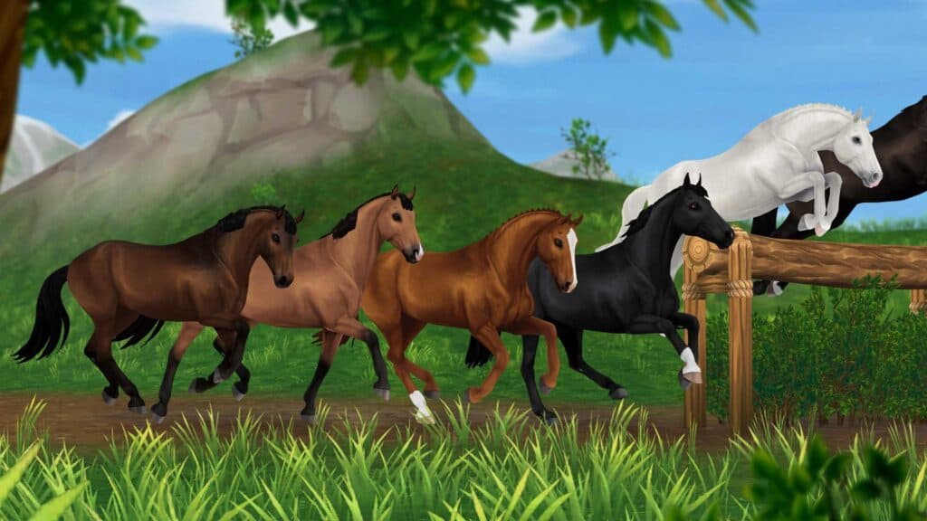Star Stable horses crossing a fence