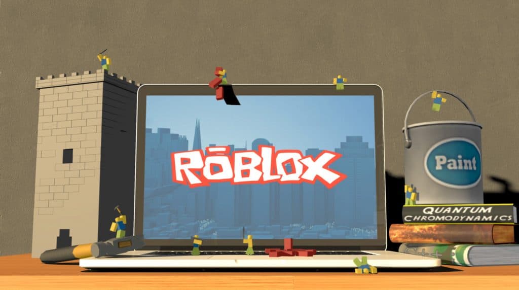 A laptop with roblox characters around it