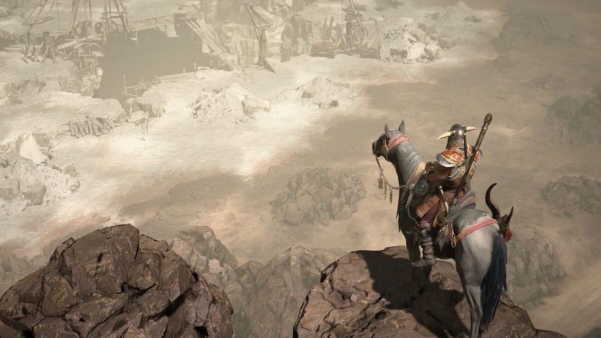 Diablo 4 character on a mount on the edge of the mountain.
