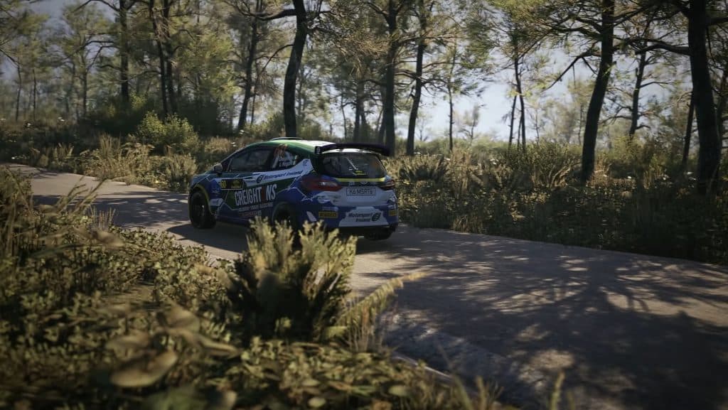 Car racing through woods in EA Sports WRC