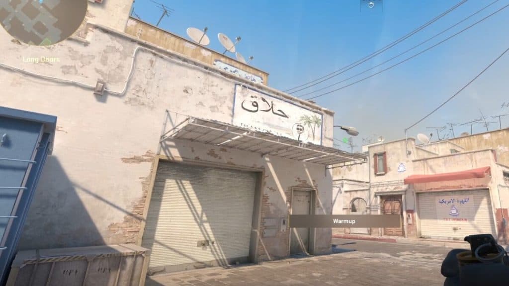 Holding a smoke for lineup at A long on Dust 2 in CS2