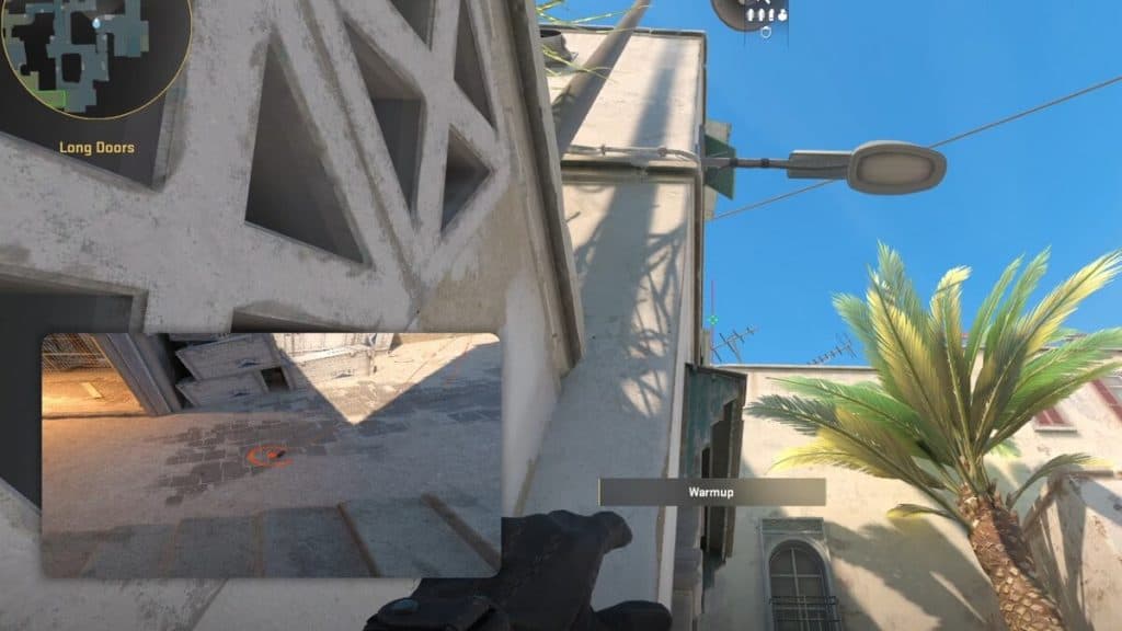 Holding smoke lineup next to A long door for a deep CT smoke on Dust 2 in CS2