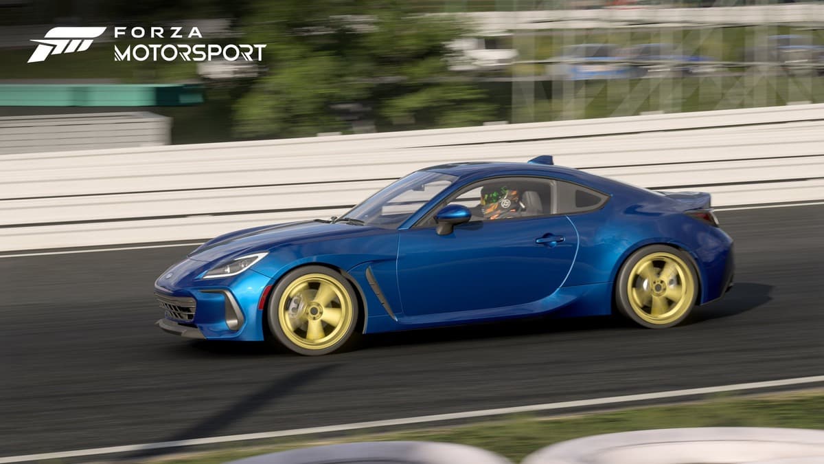Blue Subaru speeding in an iconic Suzuka race track in Forza Motorsport