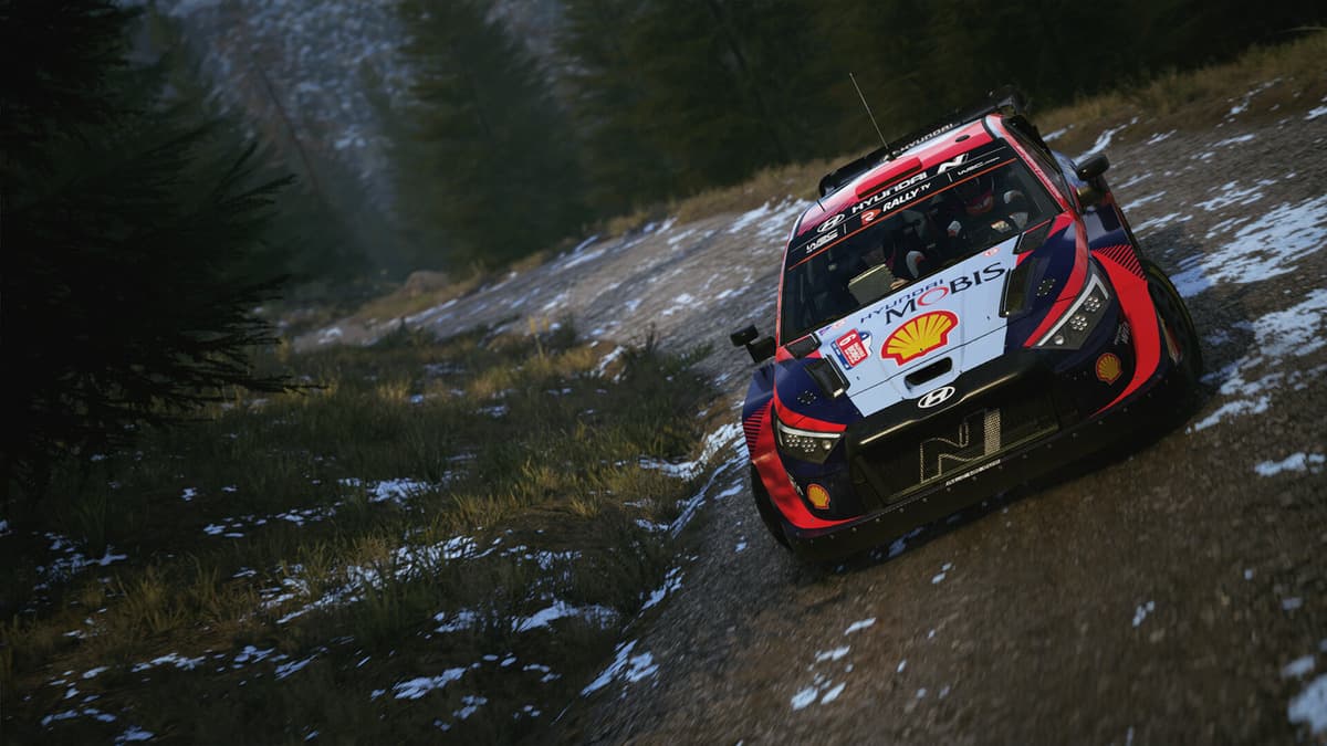 A car taking a turn in muddy track in EA Sports WRC