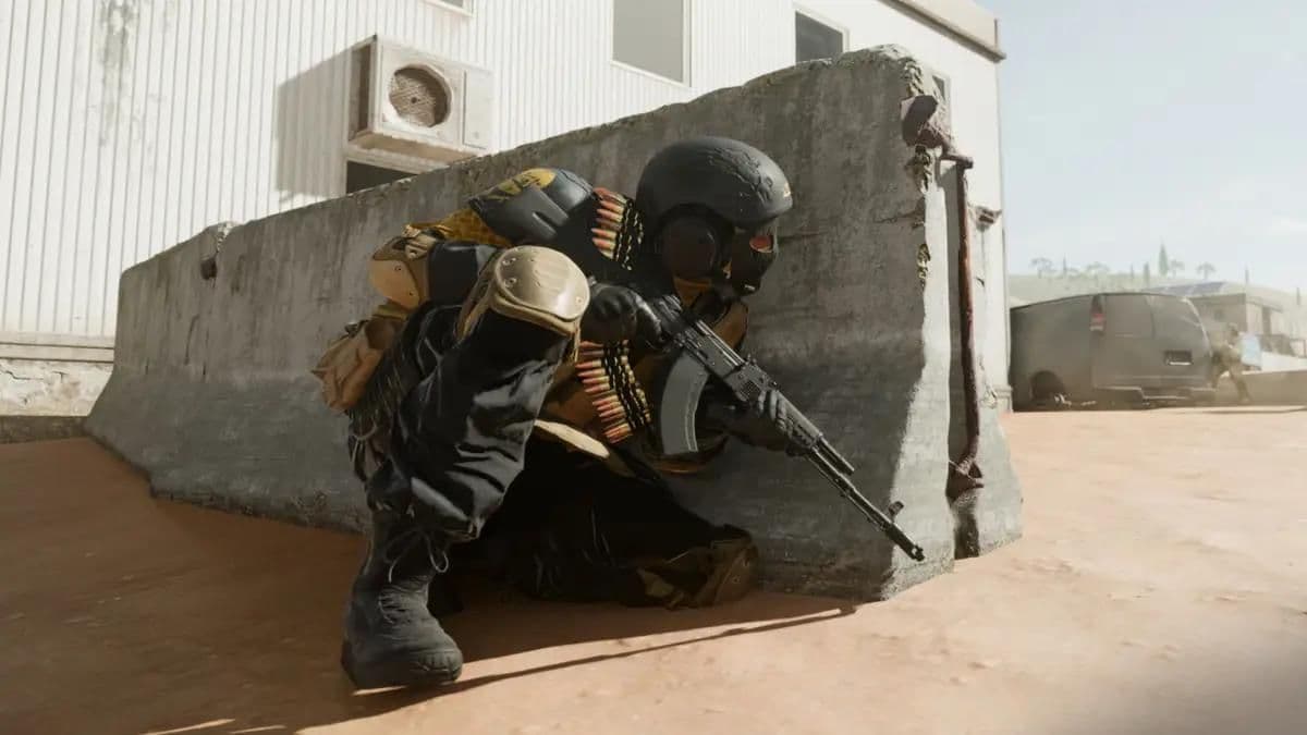 Warzone player holding rifle behind cover